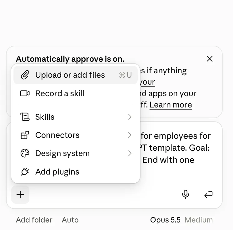 Claude message box plus menu with Upload or add files, Record a skill, Skills, Connectors, Design system and Add plugins